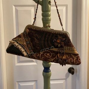Beautiful copper brown embroidered clutch with beaded strap.